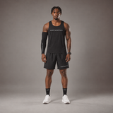Model wearing the RAWS Basketball Vest in Black with Shooting Sleeve, Shooting Shorts and Socks, front view