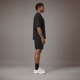 Model wearing the RAWS Off-Court T-Shirt and Shorts in Black, side view
