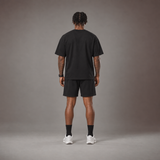 Model wearing the RAWS Off-Court T-Shirt and Shorts in Black, back view
