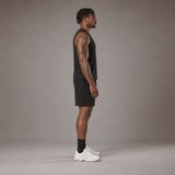 Model wearing the RAWS Off-Court Tank Top and Shorts in Black, side view