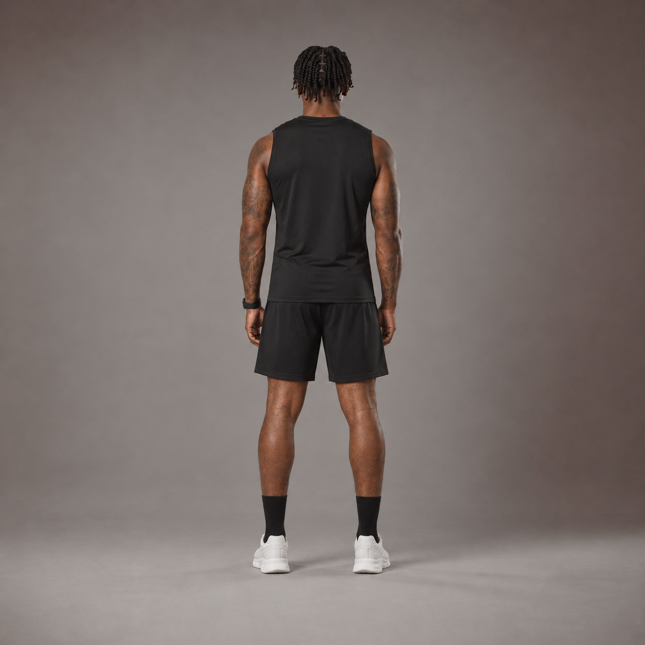 Model wearing the RAWS Off-Court Tank Top and Shorts in Black, back view