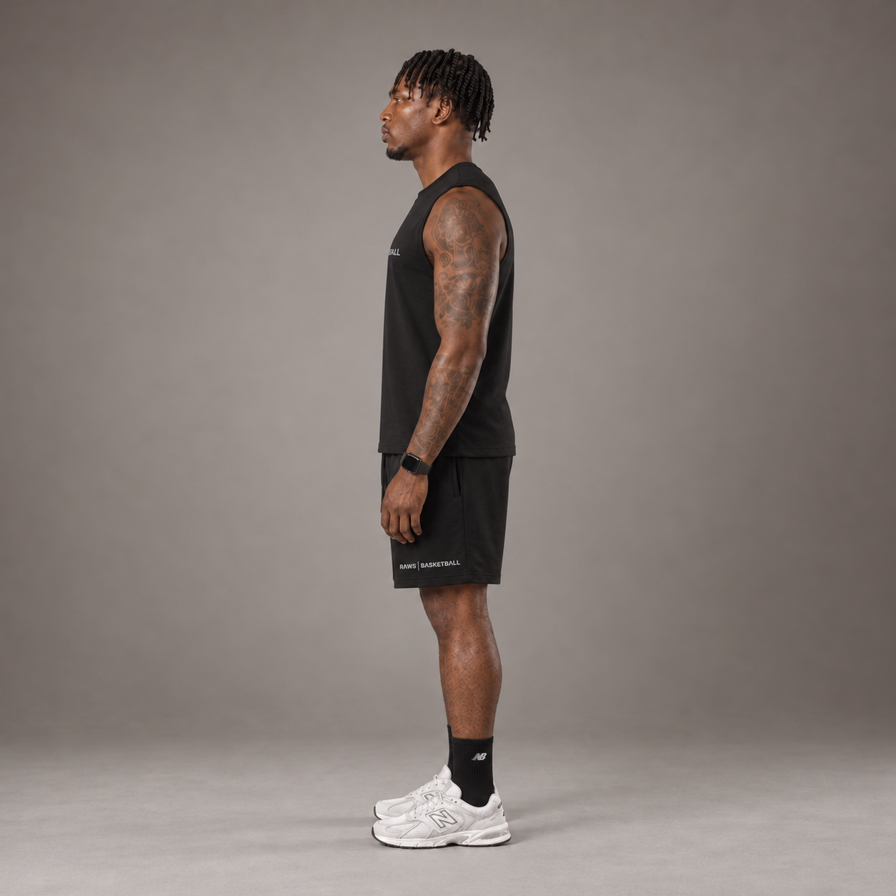 Model wearing the RAWS Off-Court Tank Top and Shorts in Black, side view