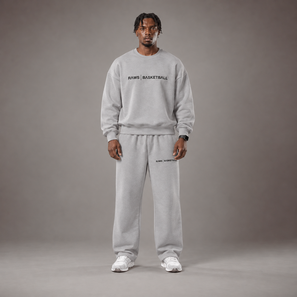Model wearing the RAWS Off-Court Crew Sweatshirt and Joggers in Grey, front view