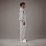 Model wearing the RAWS Off-Court Crew Sweatshirt and Joggers in Grey, side view