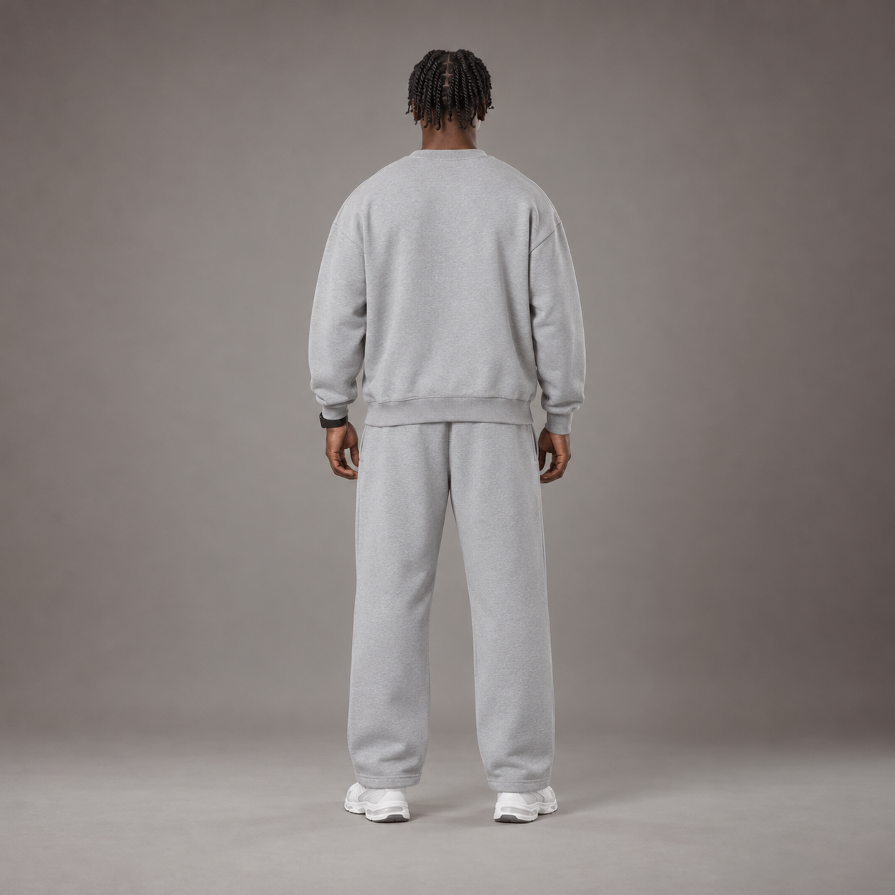 Model wearing the RAWS Off-Court Crew Sweatshirt and Joggers in Grey, back view