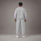 Model wearing the RAWS Off-Court Crew Sweatshirt and Joggers in Grey, back view