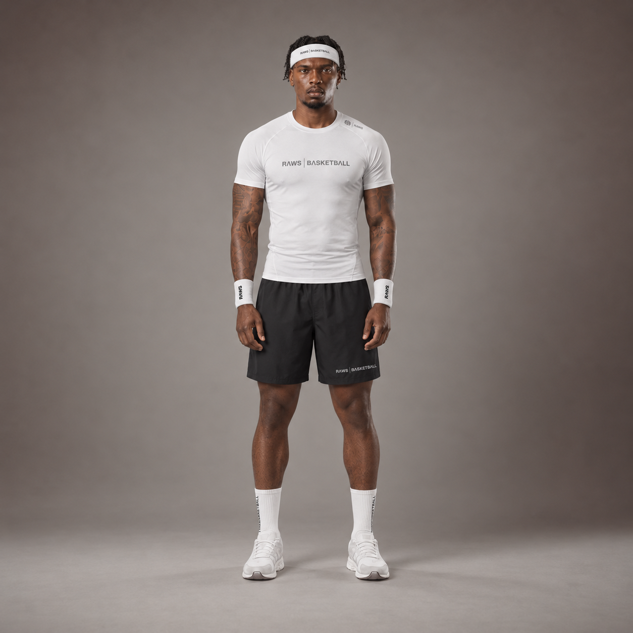 Model wearing the RAWS Basketball Compression T-Shirt in White with Headband, Sweatbands and Shooting Shorts, front view