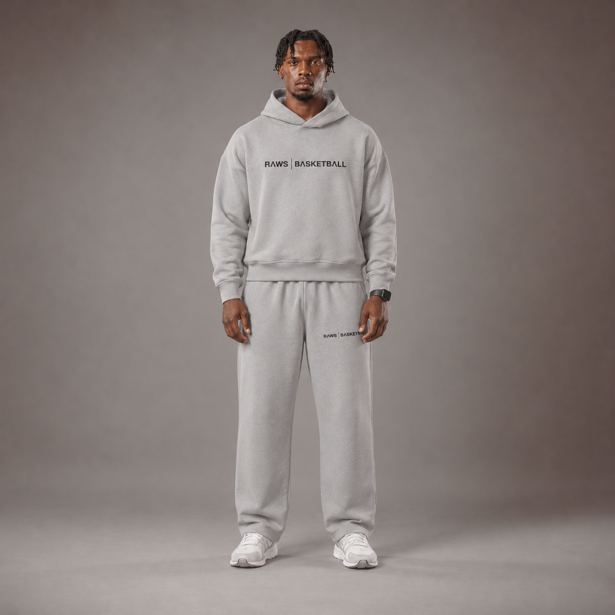 Model wearing the RAWS Off-Court Hoodie and Joggers in Grey, front view