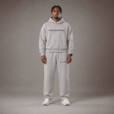 Model wearing the RAWS Off-Court Hoodie and Joggers in Grey, front view