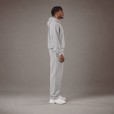 Model wearing the RAWS Off-Court Hoodie and Joggers in Grey, side view