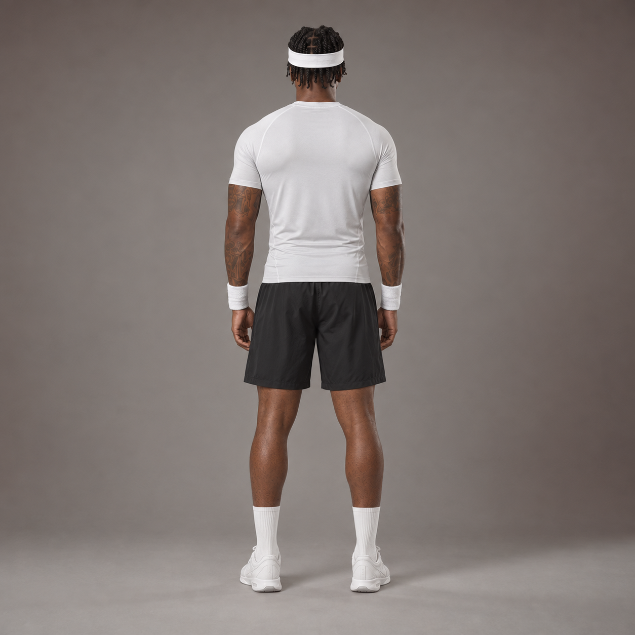 Model wearing the RAWS Basketball Compression T-Shirt in White with Headband, Sweatbands and Shooting Shorts, back view