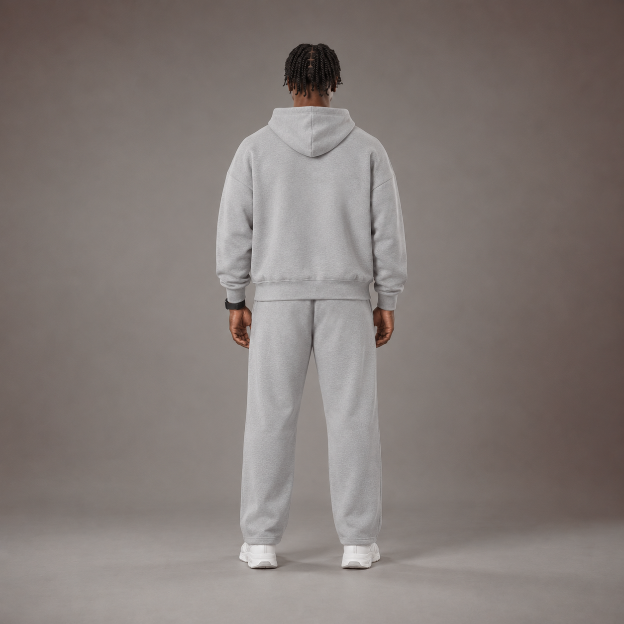Model wearing the RAWS Off-Court Hoodie and Joggers in Grey, back view