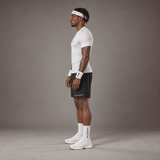 Model wearing the RAWS Basketball Compression T-Shirt in White with Headband, Sweatbands and Shooting Shorts, side view