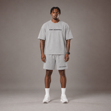 Model wearing the RAWS Off-Court T-Shirt and Shorts in Grey, front view