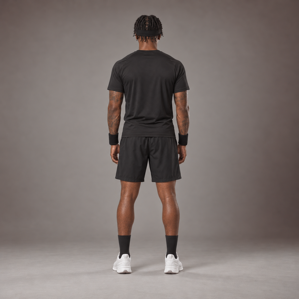 Model wearing the RAWS Basketball Shooting T-Shirt in Black with Headband, Sweatbands and Shooting Shorts, back view