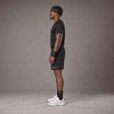 Model wearing the RAWS Basketball Shooting T-Shirt in Black with Headband, Sweatbands and Shooting Shorts, side view