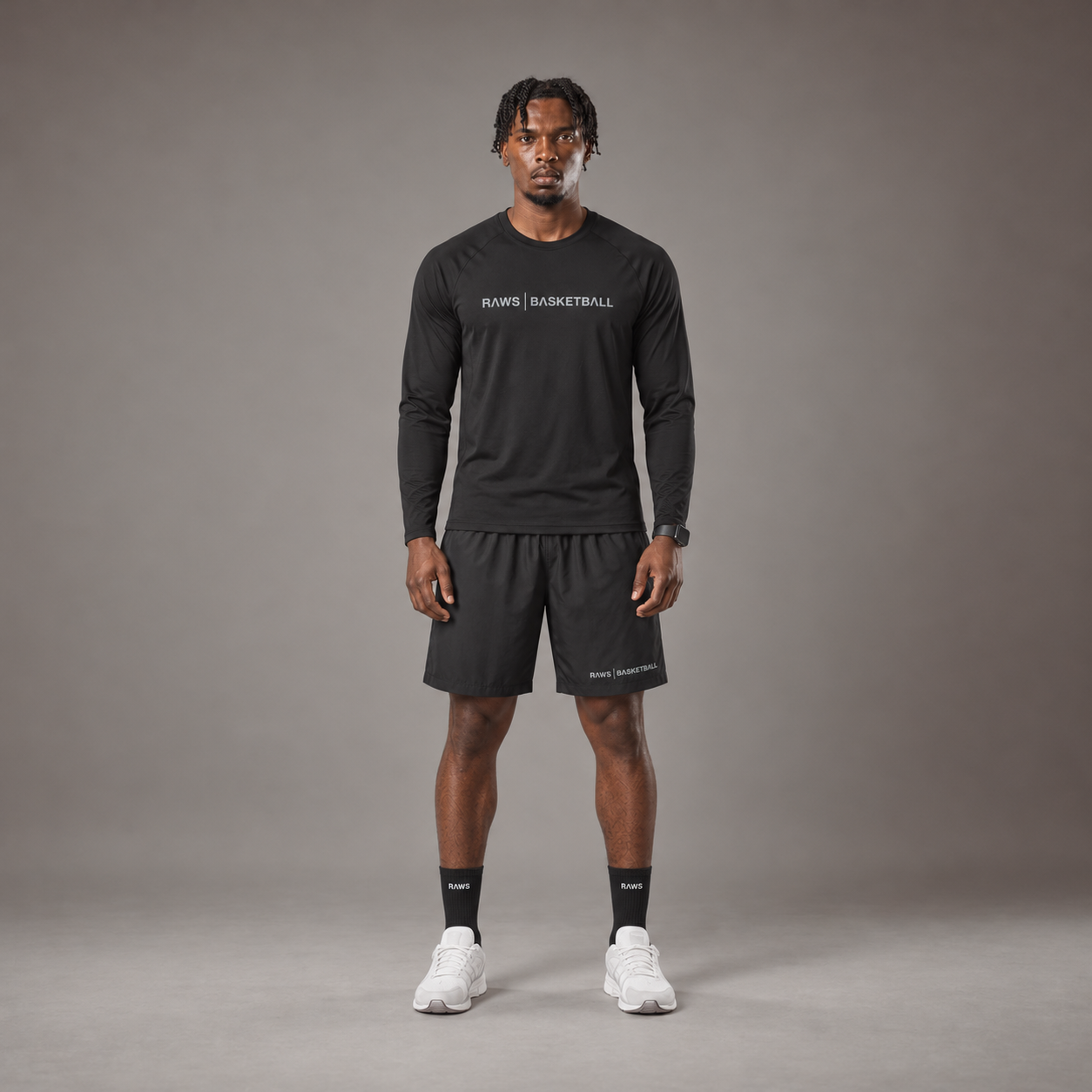 Model wearing the RAWS Basketball Shooting Long Sleeve T-Shirt in Black with Shooting Shorts, front view