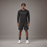 Model wearing the RAWS Basketball Shooting Long Sleeve T-Shirt in Black with Shooting Shorts, front view