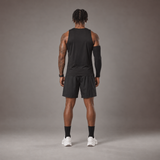 Model wearing the RAWS Basketball Vest in Black with Shooting Sleeve, Shooting Shorts and Socks, back view