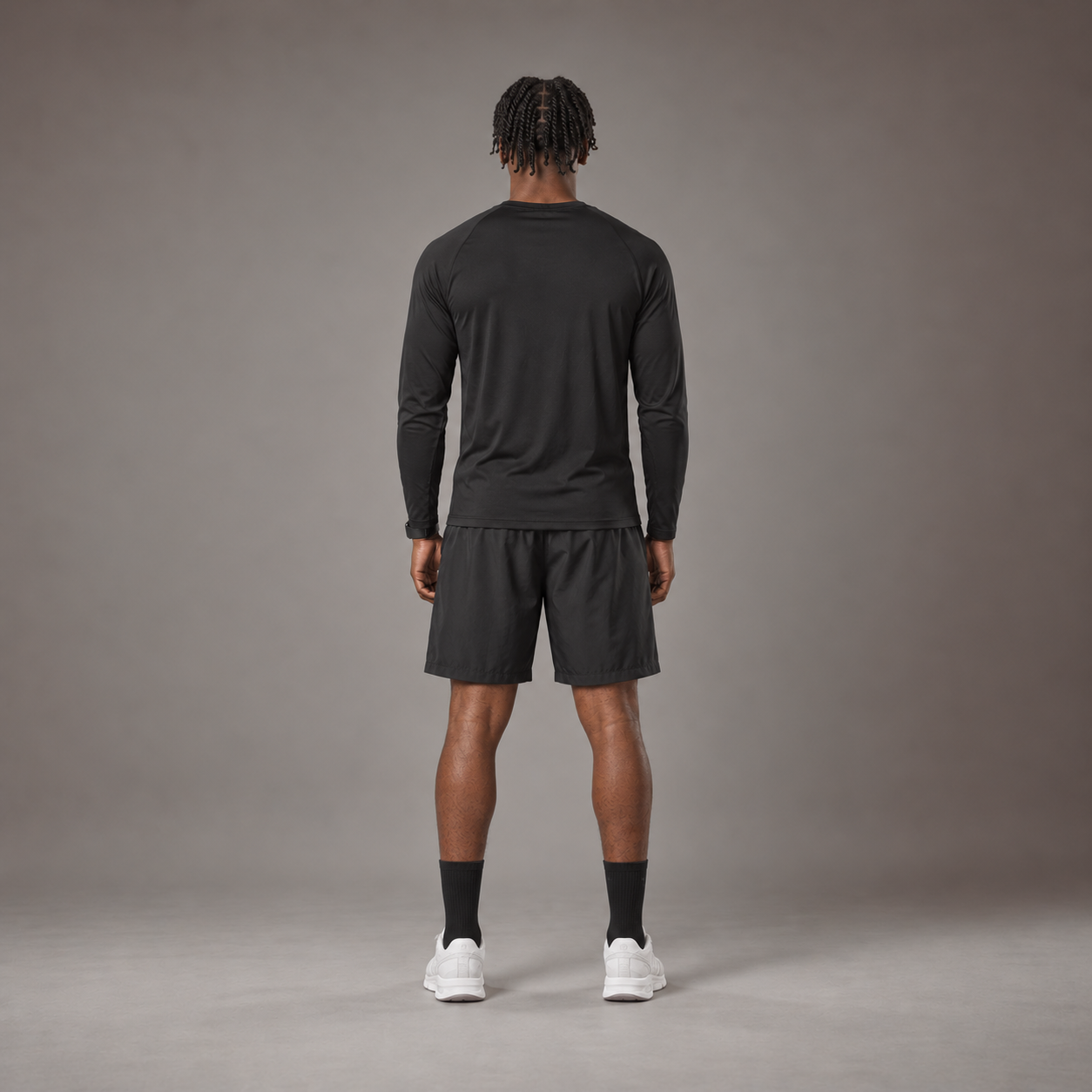 Model wearing the RAWS Basketball Shooting Long Sleeve T-Shirt in Black with Shooting Shorts, back view