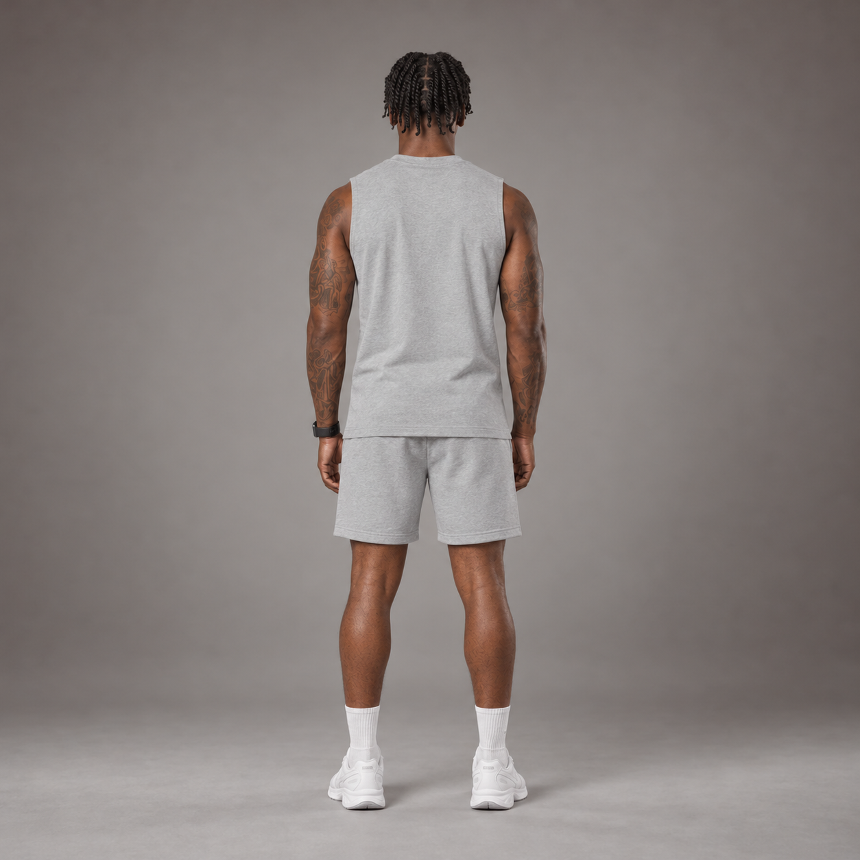 Model wearing the RAWS Off-Court Tank Top and Shorts in Grey, back view