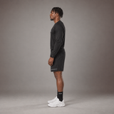 Model wearing the RAWS Basketball Shooting Long Sleeve T-Shirt in Black with Shooting Shorts, side view