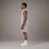 Model wearing the RAWS Off-Court Tank Top and Shorts in Grey, side view