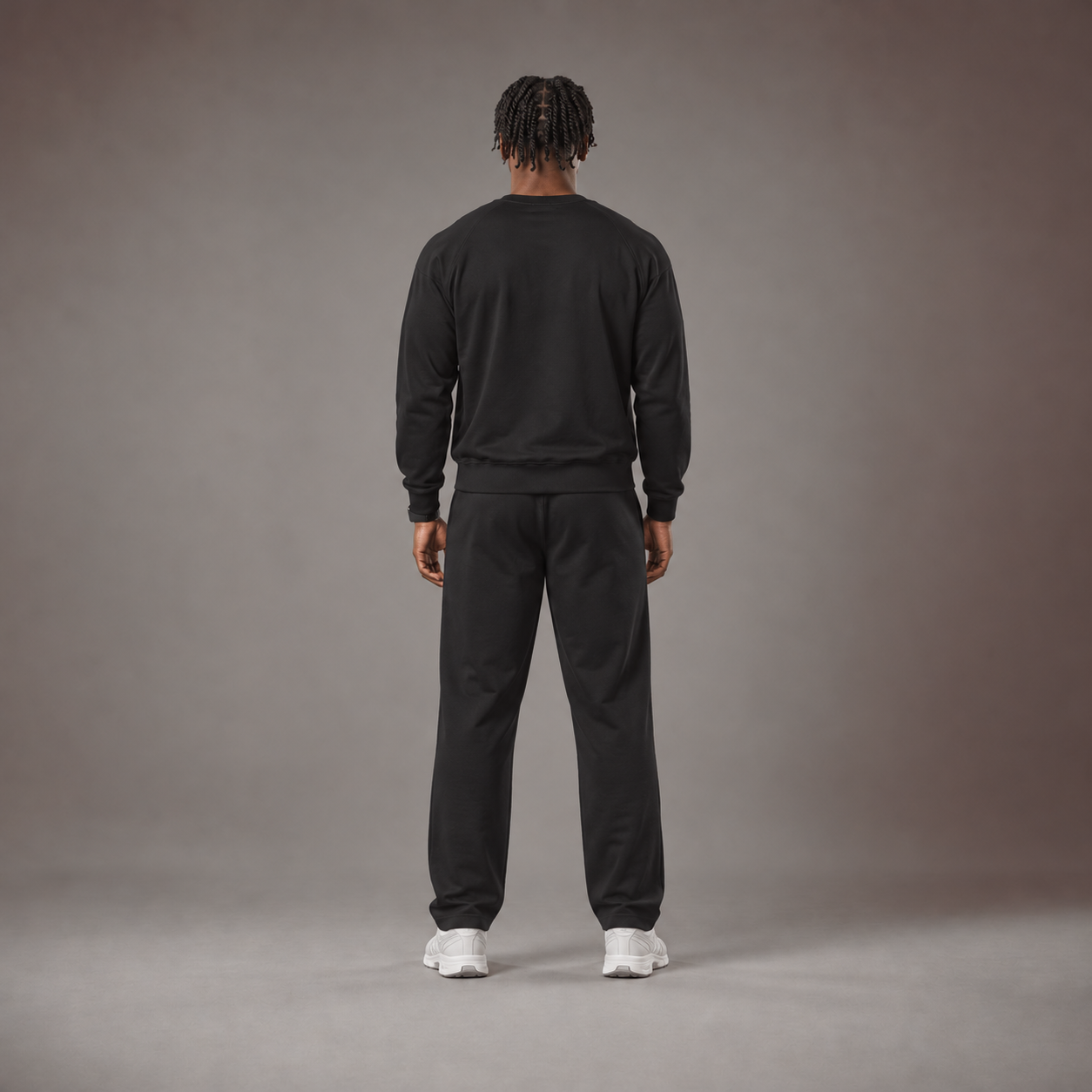 Model wearing the RAWS Off-Court Crew Sweatshirt and Joggers in Black, back view