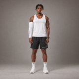 Model wearing the RAWS Basketball Vest in White with Shooting Sleeve, Shooting Shorts and Socks, front view