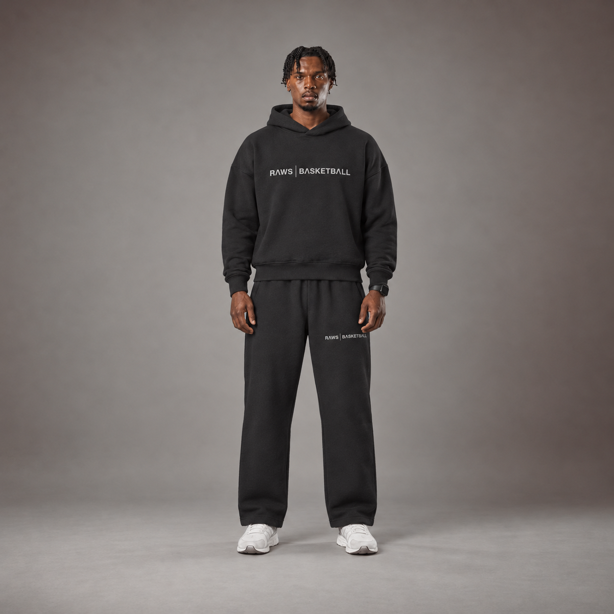 Model wearing the RAWS Off-Court Hoodie and Joggers in Black, front view