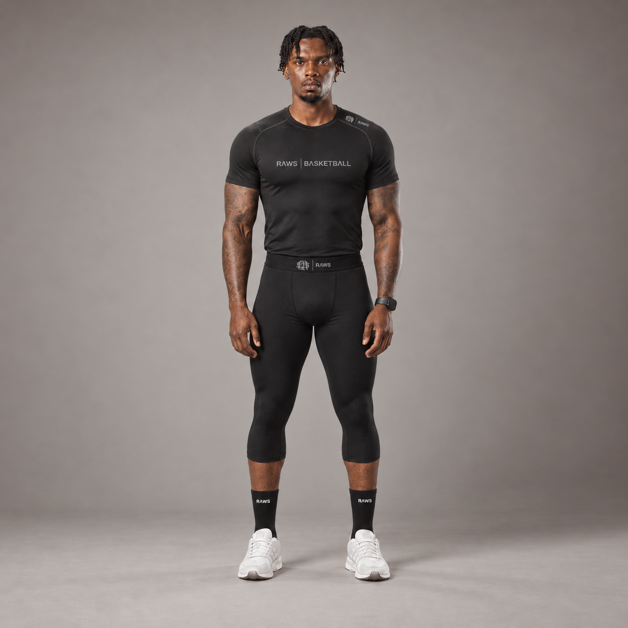 Model wearing the RAWS Basketball Compression T-Shirt and Compression 3/4 Leggings in Black, front view