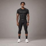 Model wearing the RAWS Basketball Compression T-Shirt and Compression 3/4 Leggings in Black, front view