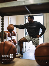 RAWS Basketball black Off-Court Crew Sweatshirt and grey Shorts in the gym