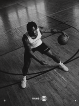 RAWS Basketball player dribbling in the white Basketball Vest and Shooting Shorts