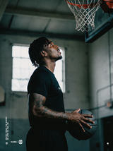 RAWS Basketball player in the black Shooting T-Shirt under the hoop